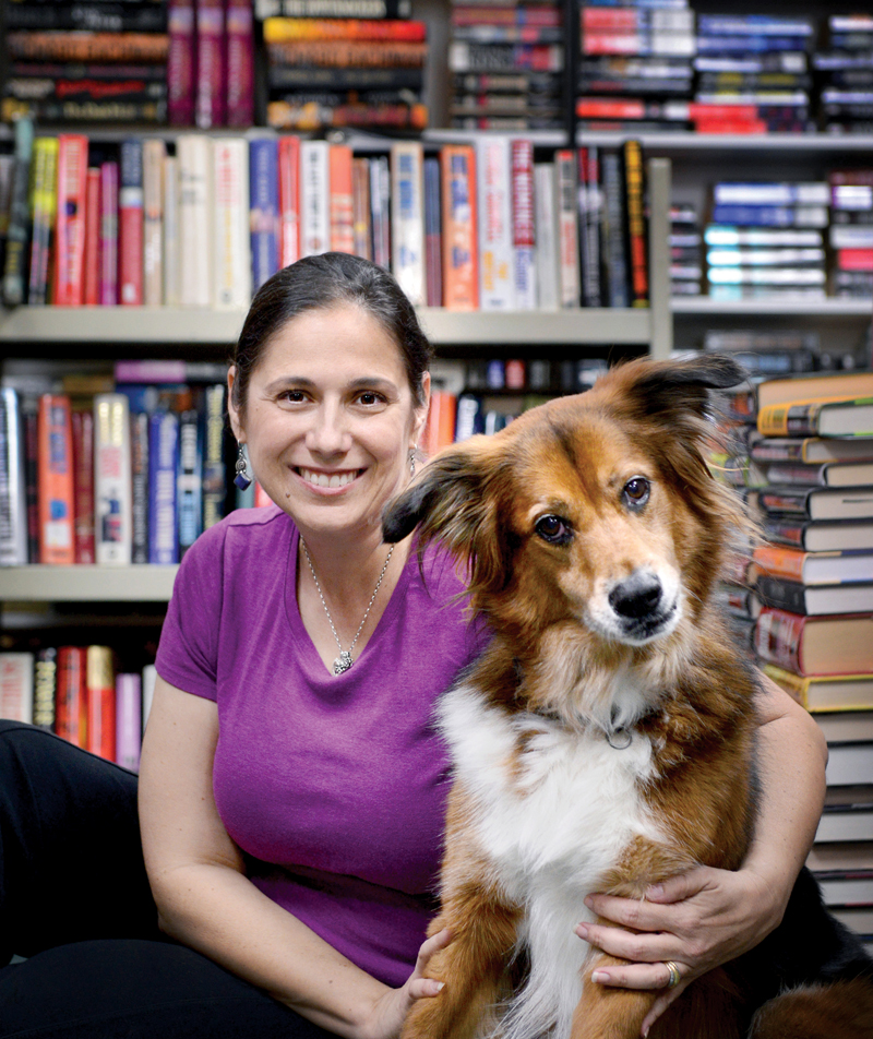 Barbara Barone, owner of Brant's Books, and her dog Elvis. Photo by Jessica McKnight.